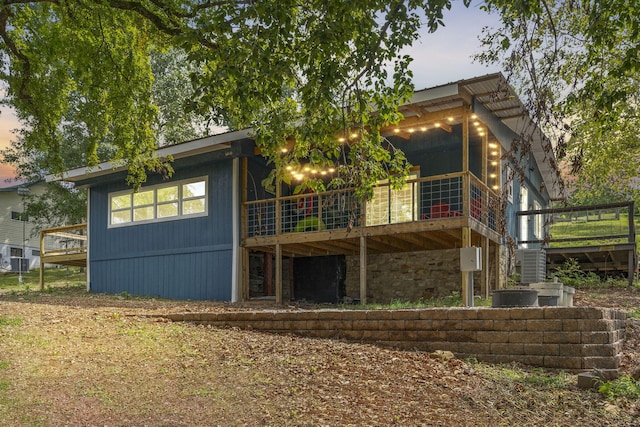 view of back house at dusk