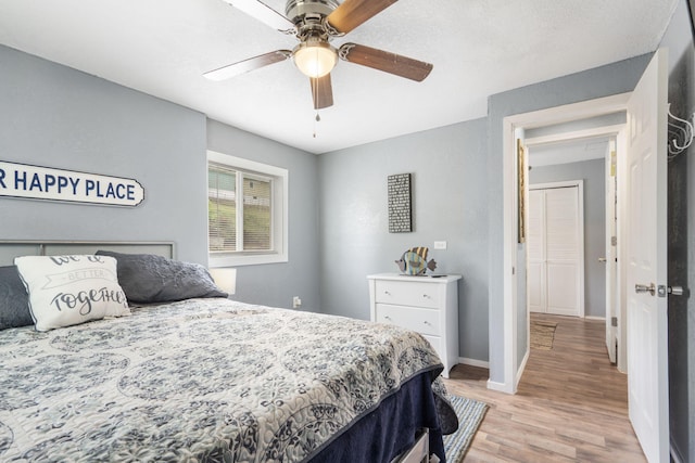 bedroom featuring ceiling fan and light hardwood / wood-style floors