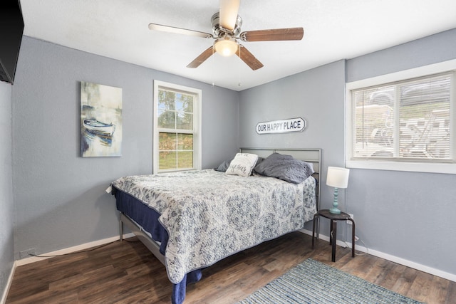 bedroom featuring dark hardwood / wood-style floors and ceiling fan