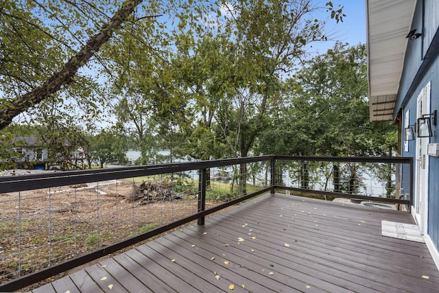 wooden terrace with a water view