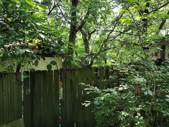 view of gate with fence