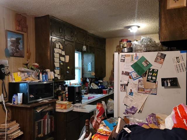 miscellaneous room featuring a textured ceiling