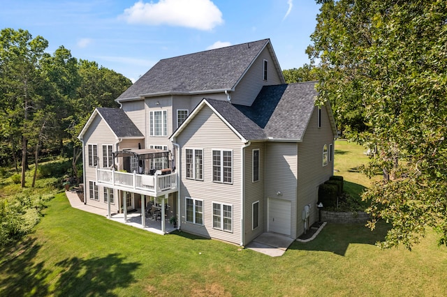 back of house with a patio, a yard, and a deck