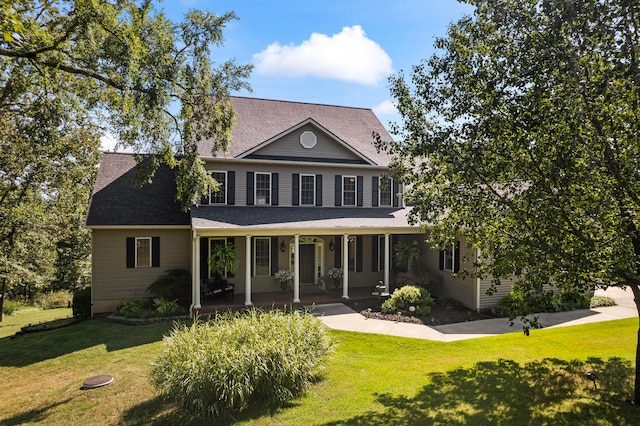 view of front of home with a front lawn and covered porch