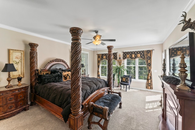 carpeted bedroom featuring ornamental molding and ceiling fan