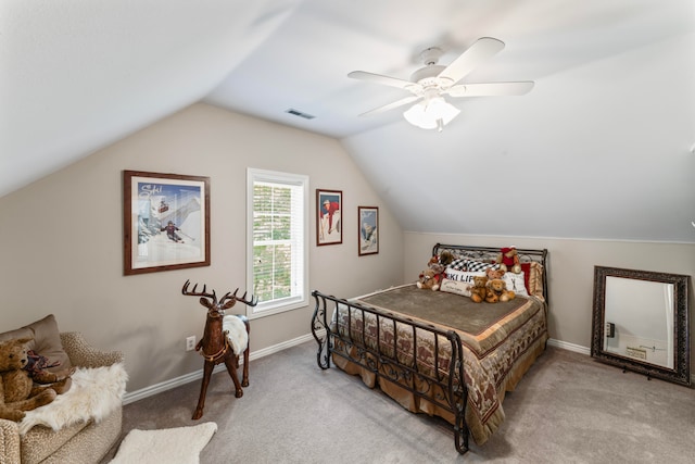 bedroom with lofted ceiling, ceiling fan, and light carpet