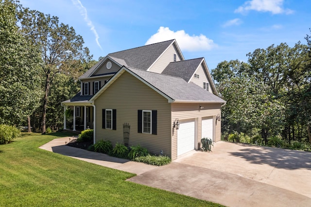 view of side of home with a garage and a yard