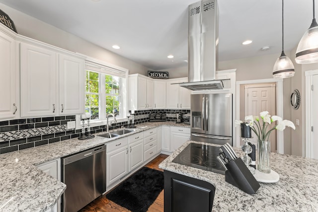 kitchen featuring pendant lighting, appliances with stainless steel finishes, and white cabinetry