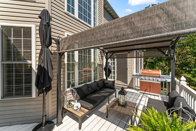 wooden deck featuring outdoor lounge area and grilling area