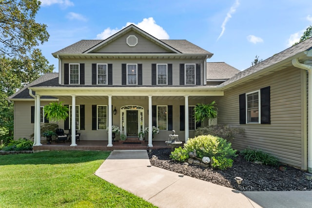 view of front facade with a porch and a front yard