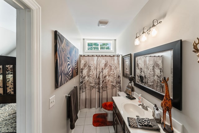 bathroom featuring vanity, tile patterned flooring, and toilet