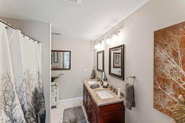 bathroom with vanity and tile patterned flooring