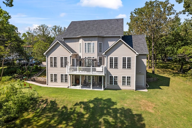 back of house with a patio and a lawn