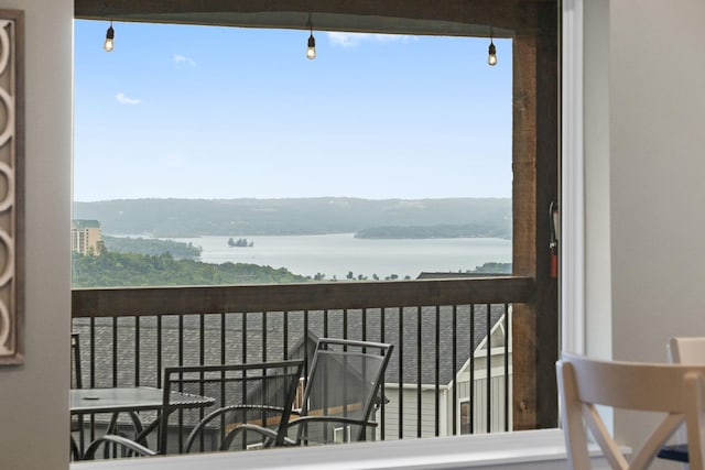 balcony featuring a water view