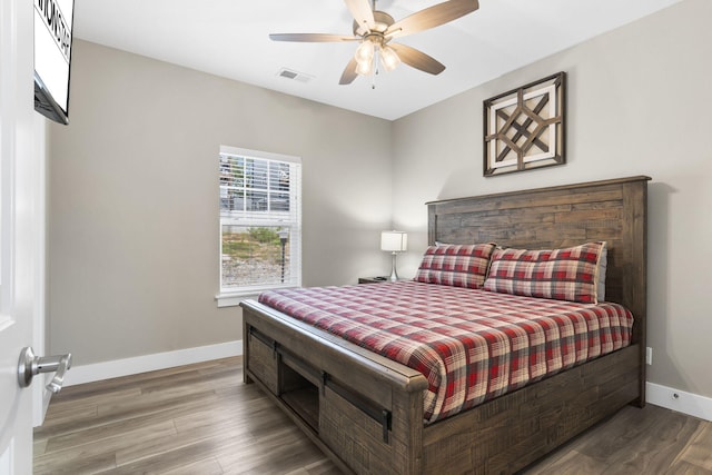 bedroom with ceiling fan and wood-type flooring