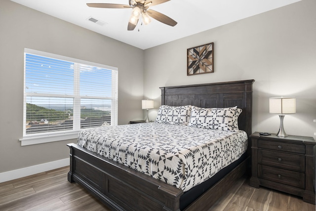 bedroom featuring ceiling fan and hardwood / wood-style flooring