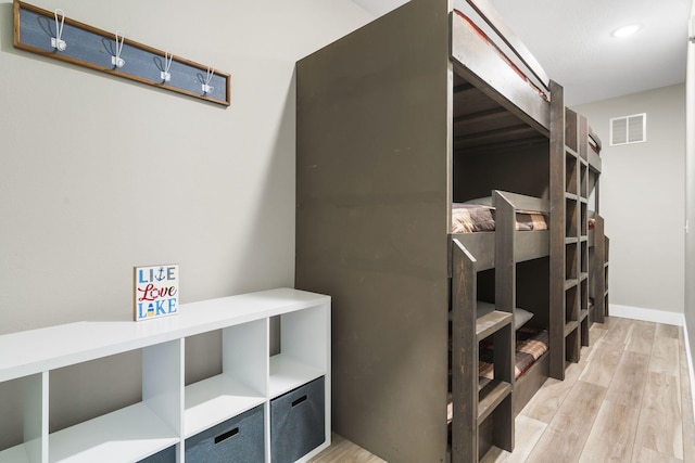 bedroom with wood-type flooring