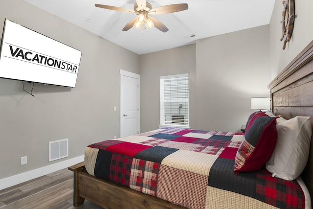 bedroom with wood-type flooring and ceiling fan