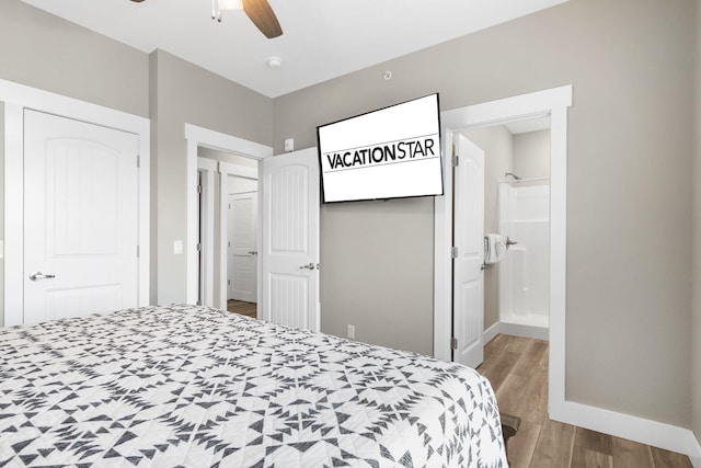 bedroom with hardwood / wood-style flooring, ceiling fan, and ensuite bathroom