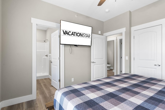 bedroom with a closet, ceiling fan, dark hardwood / wood-style flooring, and ensuite bath