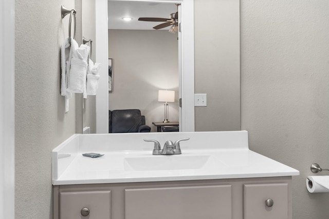 bathroom featuring vanity and ceiling fan