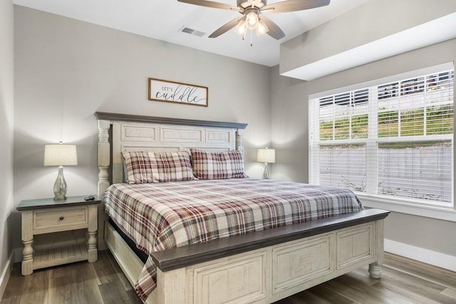 bedroom with ceiling fan and dark hardwood / wood-style floors