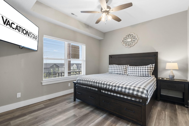 bedroom with ceiling fan and hardwood / wood-style flooring