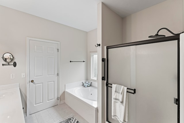 bathroom with tile patterned floors, separate shower and tub, and vanity