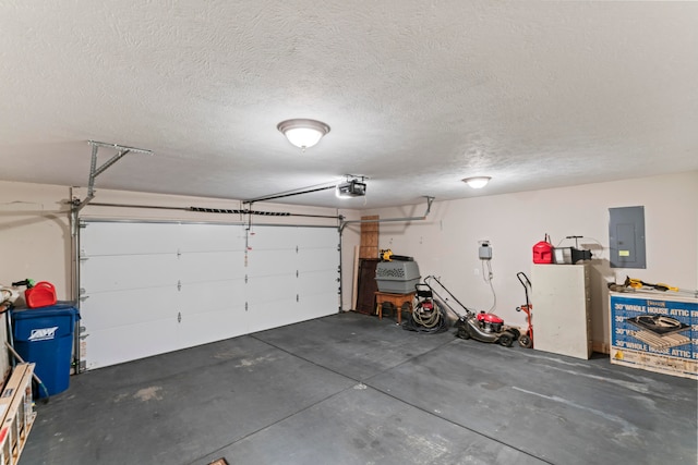 garage with electric panel and a garage door opener