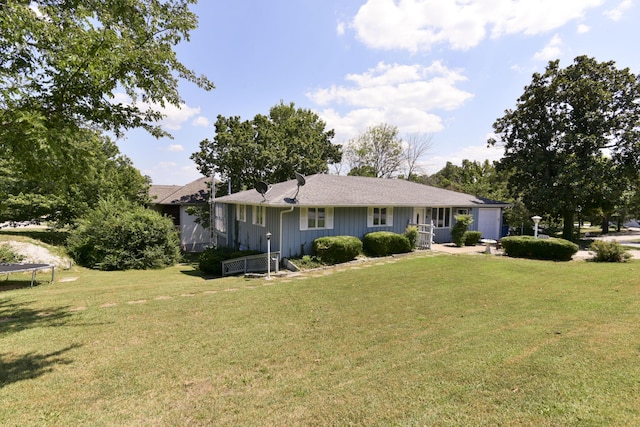 1029 Cliff Dr, Branson, MO 65616 - single story home with a garage, a front lawn, board and batten siding, and a trampoline