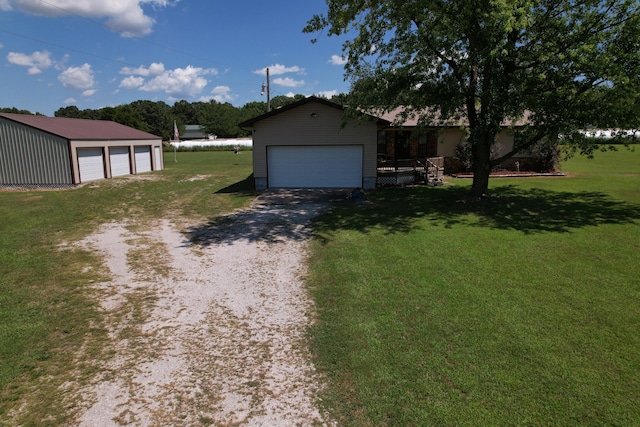 view of side of home with a garage, a yard, and an outdoor structure