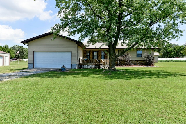 ranch-style home featuring a garage and a front lawn