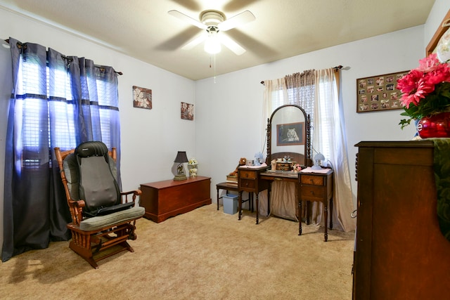 office featuring light carpet and ceiling fan