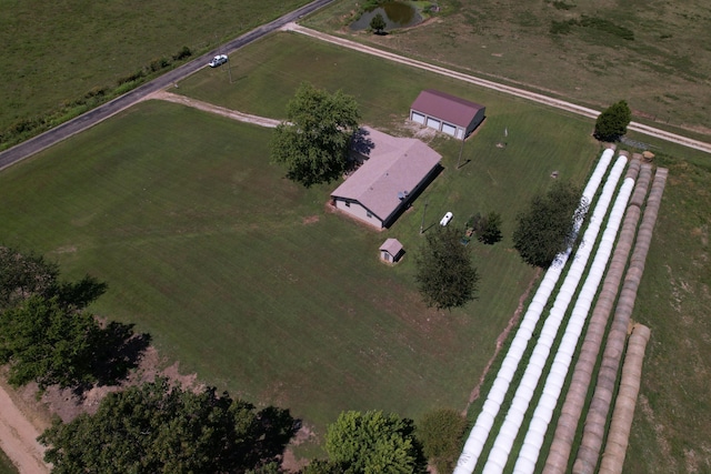 birds eye view of property with a rural view