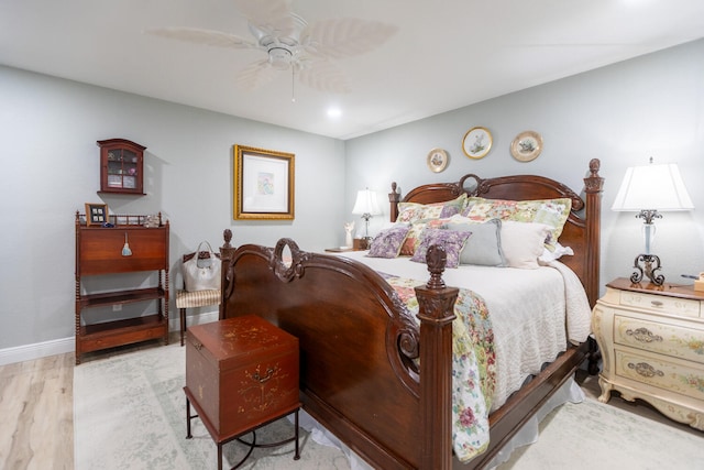 bedroom featuring light hardwood / wood-style floors and ceiling fan