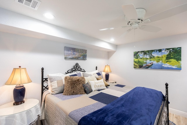 bedroom featuring ceiling fan and hardwood / wood-style floors