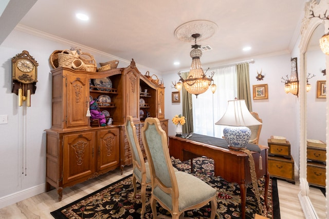 dining area featuring ornamental molding, a chandelier, and light wood-type flooring