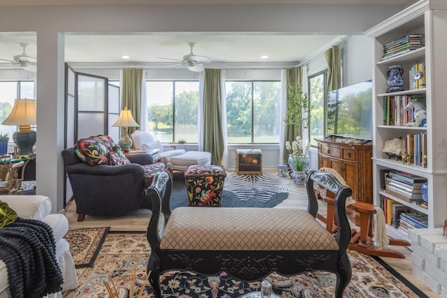 sunroom / solarium with ceiling fan