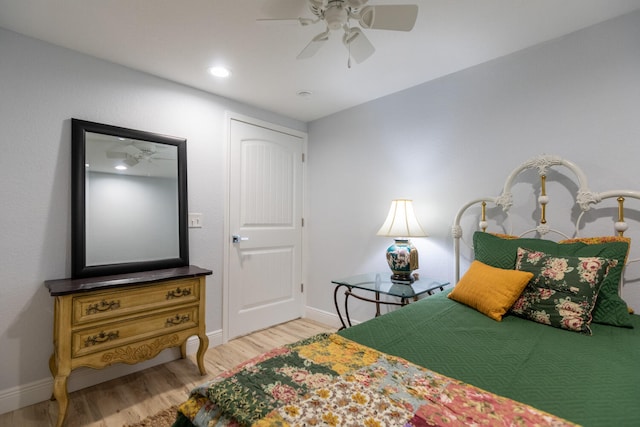 bedroom featuring light wood-type flooring and ceiling fan