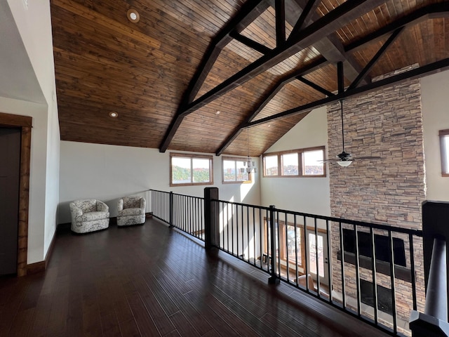 hallway with dark hardwood / wood-style floors, wooden ceiling, high vaulted ceiling, and beamed ceiling