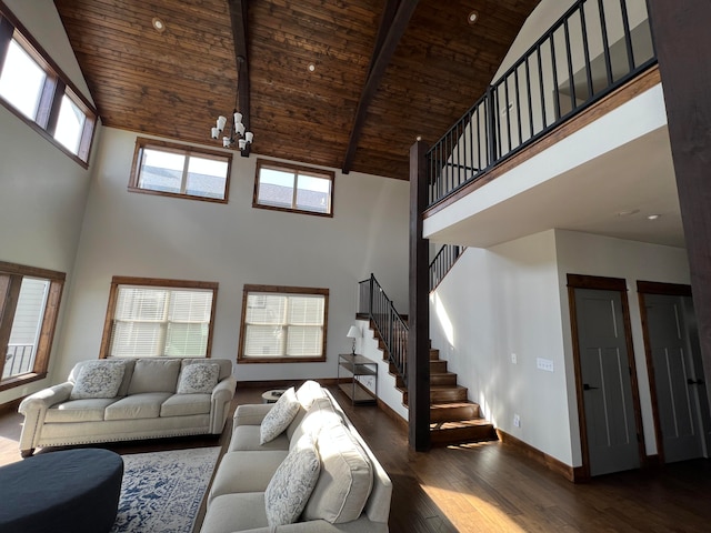 living room with high vaulted ceiling, plenty of natural light, and dark hardwood / wood-style floors