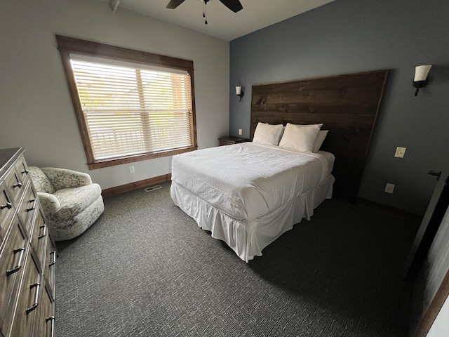 bedroom featuring dark carpet and ceiling fan