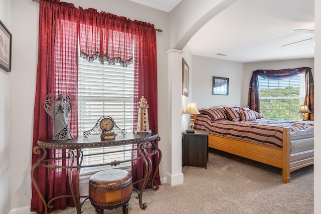 bedroom featuring ceiling fan and carpet