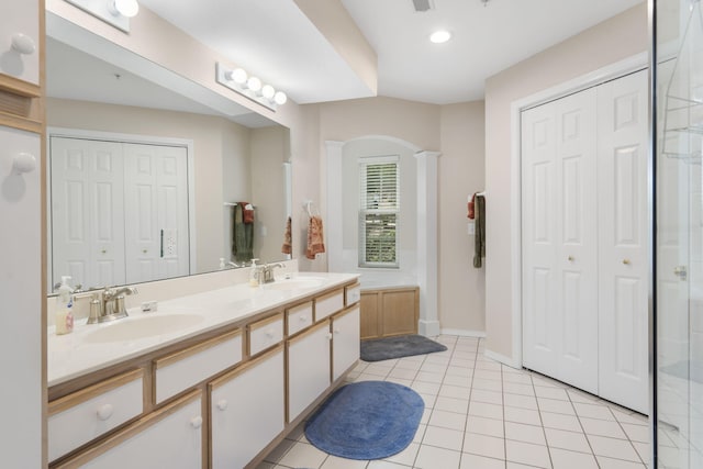 bathroom with tile patterned floors and vanity