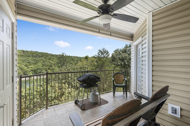 balcony featuring a grill and ceiling fan