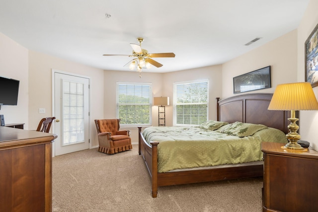 bedroom featuring light carpet and ceiling fan