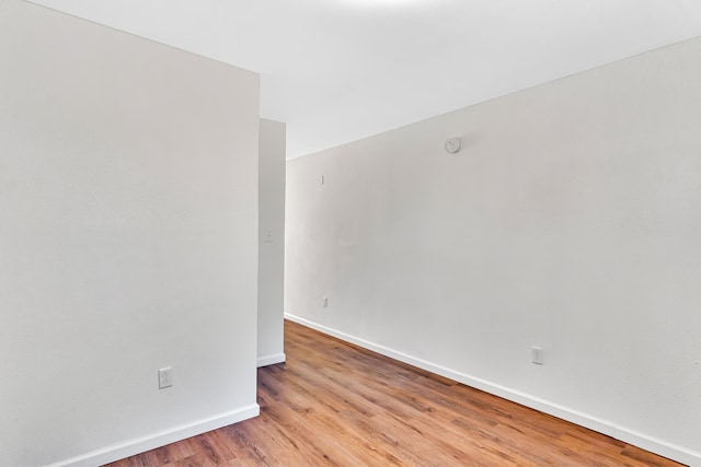 unfurnished room with light hardwood / wood-style flooring