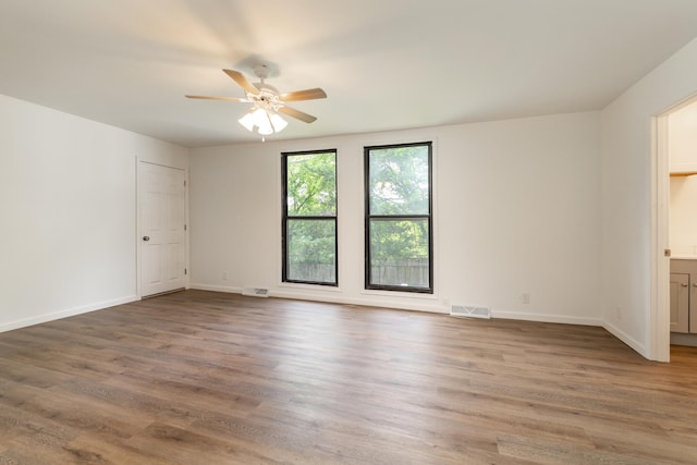 unfurnished room featuring wood-type flooring and ceiling fan
