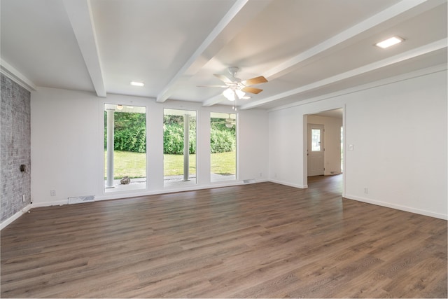 unfurnished room featuring beamed ceiling, dark hardwood / wood-style flooring, and ceiling fan
