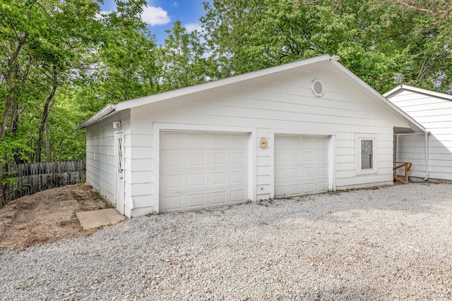 garage featuring wooden walls